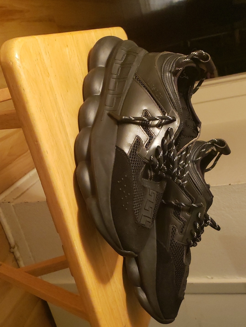 Versace Chain Reaction sneakers in the "Triple Black